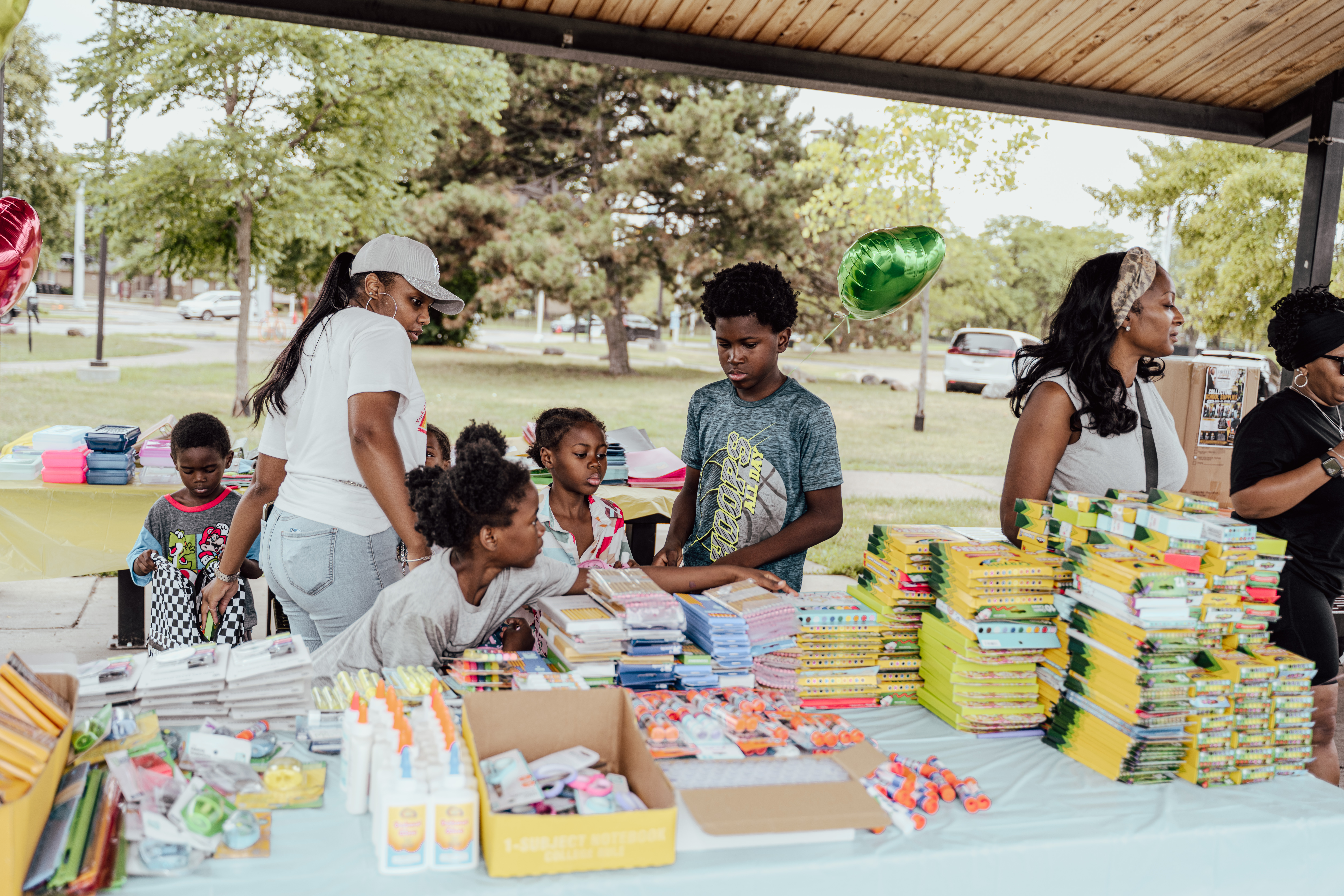 Detroit families and volunteers together at the Back-to-School Drive