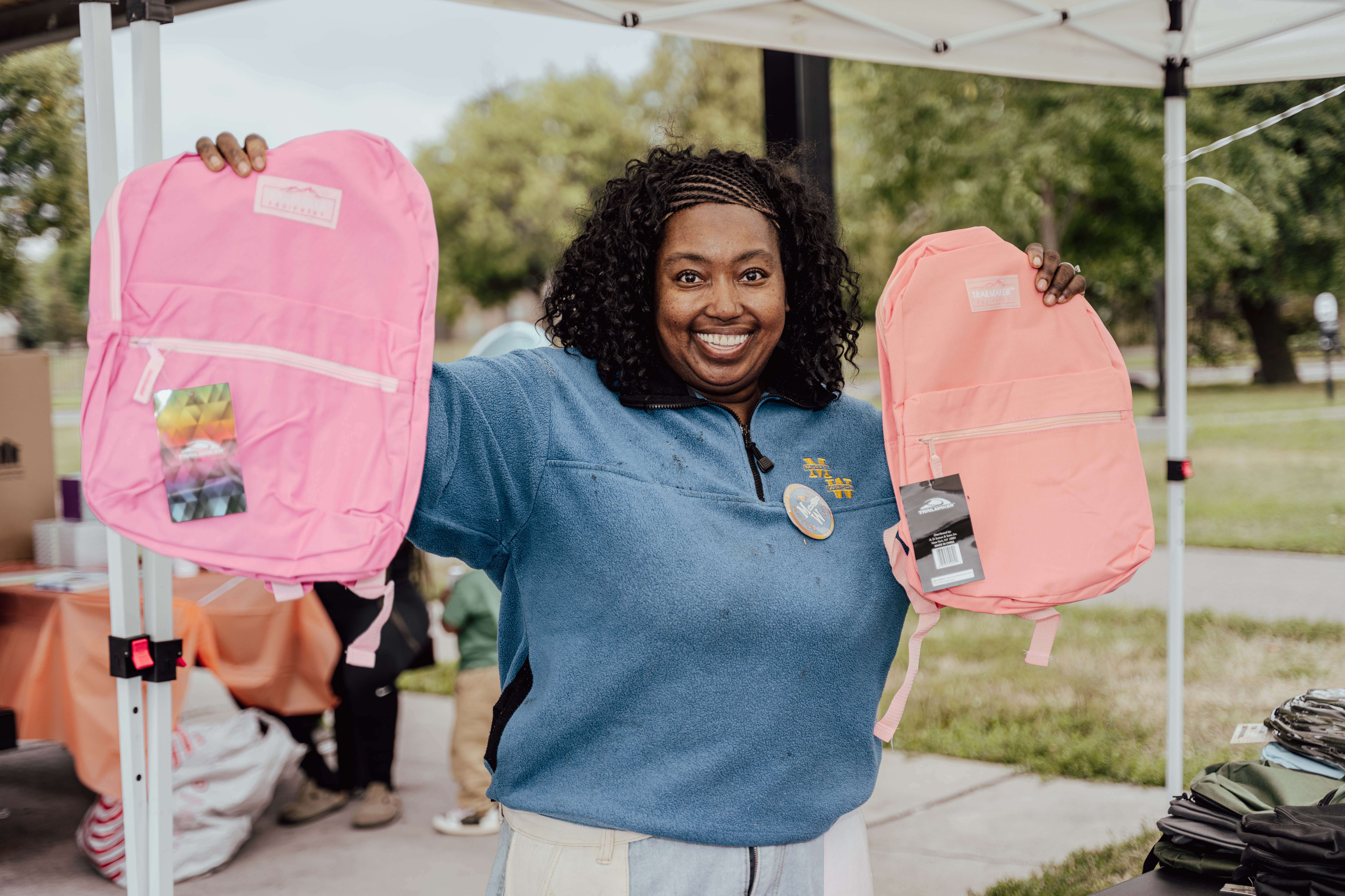 Smiling participants at The Drell Legacy Foundation Back-to-School Drive